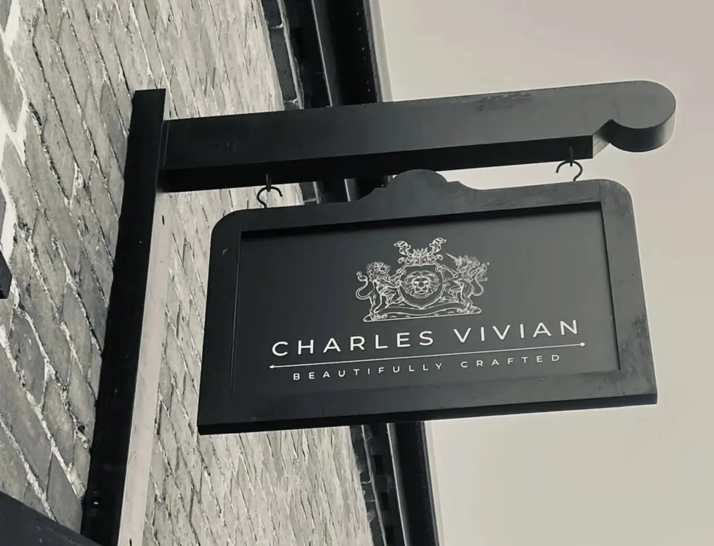 The Charles Vivian hanging sign outside the showroom — Beautifully Crafted