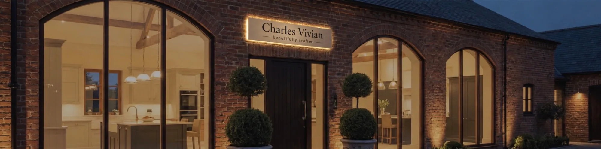 The Charles Vivian showroom at dusk — Red Brick Barn, Clavering, Essex
