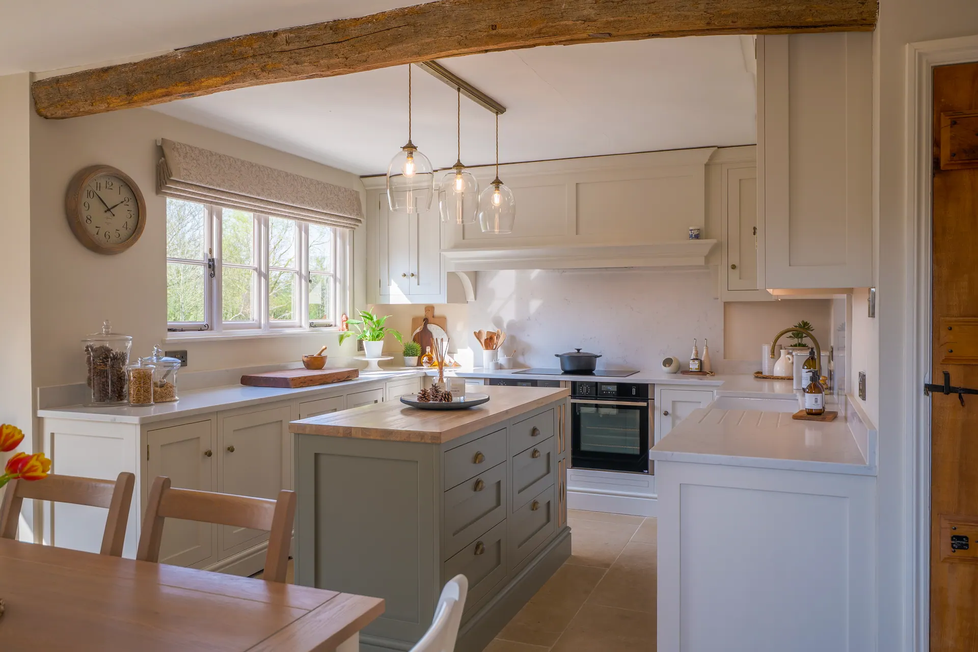 A beamed cottage kitchen by Charles Vivian