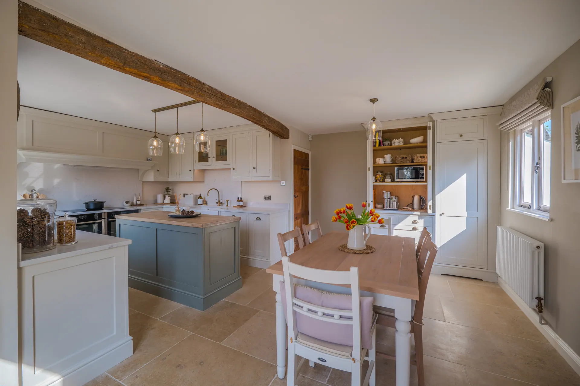 A beamed cottage kitchen by Charles Vivian