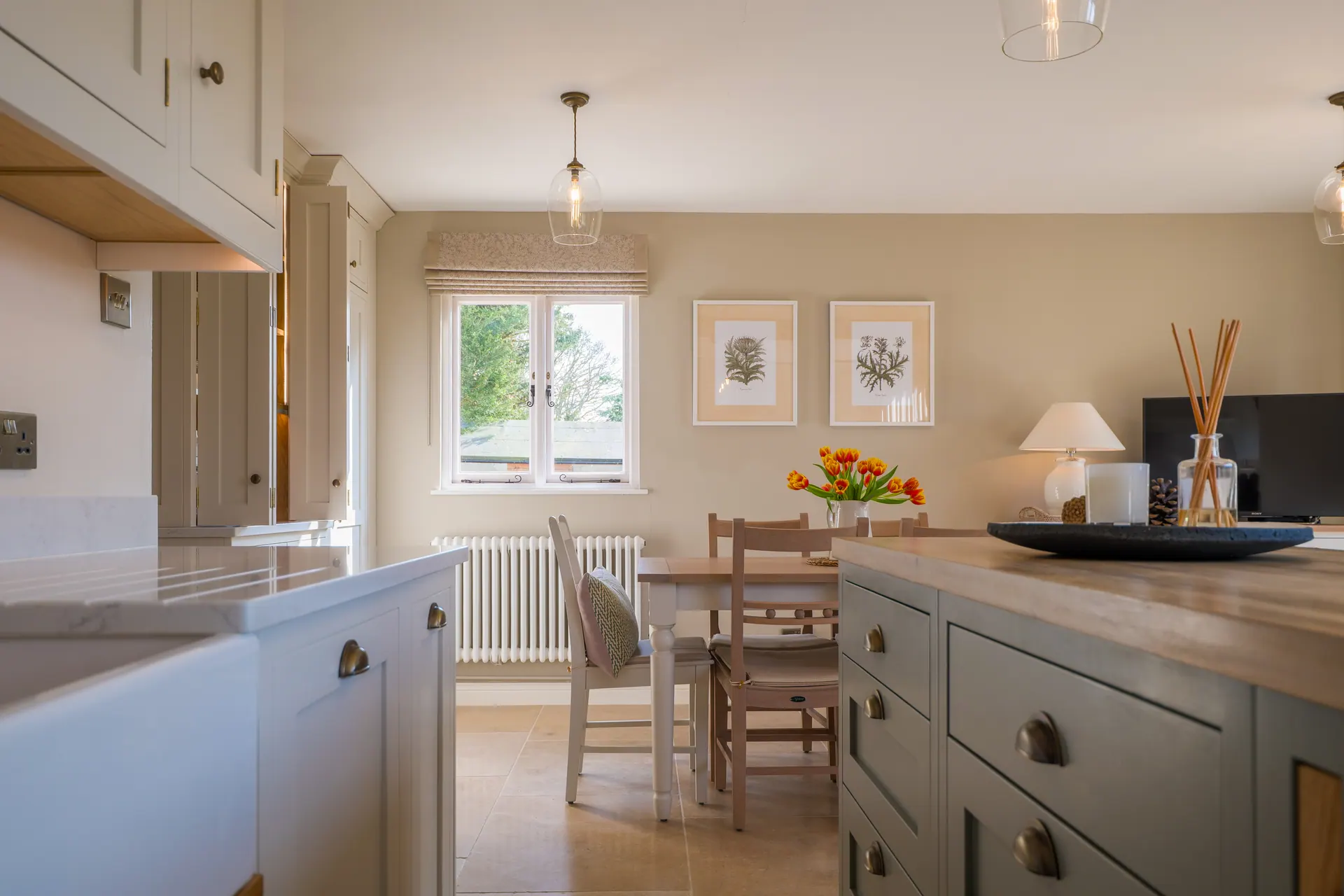 A beamed cottage kitchen by Charles Vivian