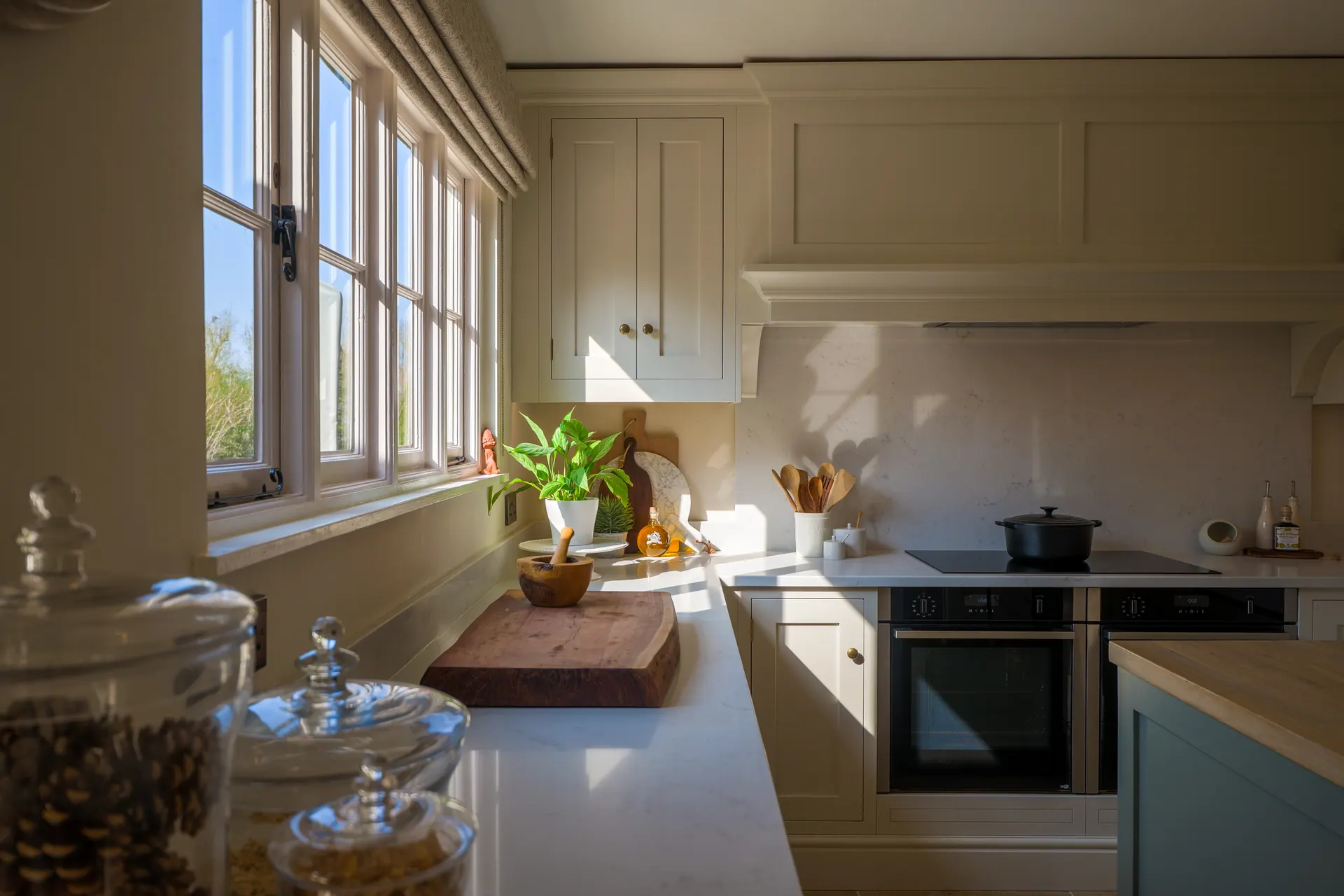 A beamed cottage kitchen by Charles Vivian