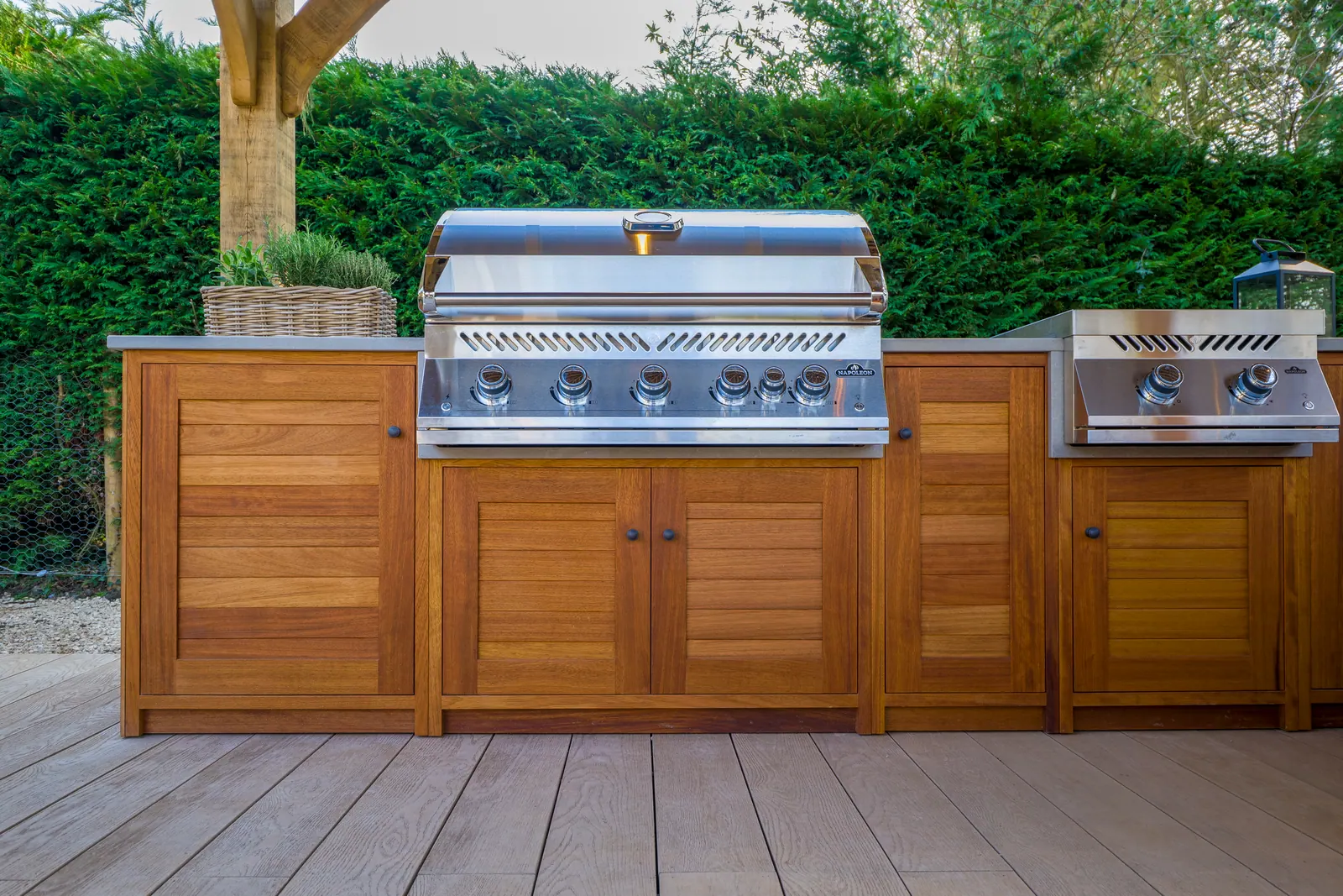 The Garden Pavilion Kitchen — built-in grill and hardwood cabinetry